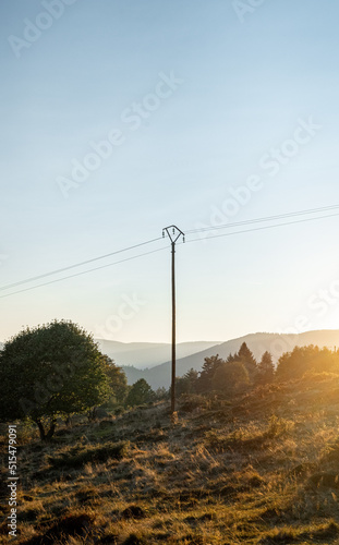 Electric pole in the montains, at sunset - Alsace
