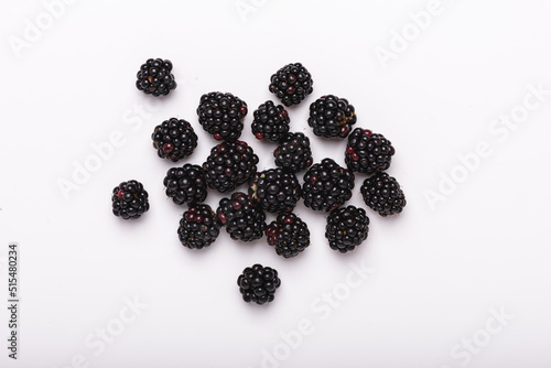 Fresh blackberries on a white background, top view