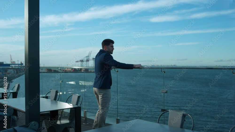 Successful man dreaming morning on luxury cafe balcony. Handsome freelancer rest Successful man dreaming morning on luxury cafe balcony. Handsome freelancer rest