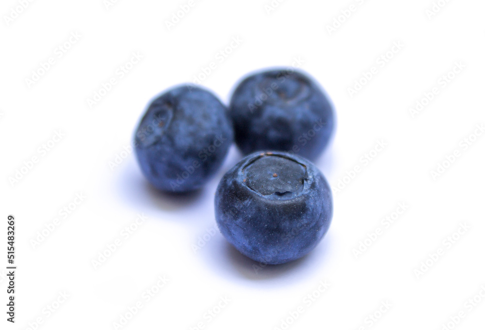 three berries lie on a white background three berries lie on a white background