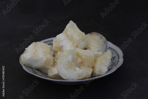 Boiled cassava on black background