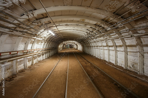 Dark tunnel in iron ore mine.