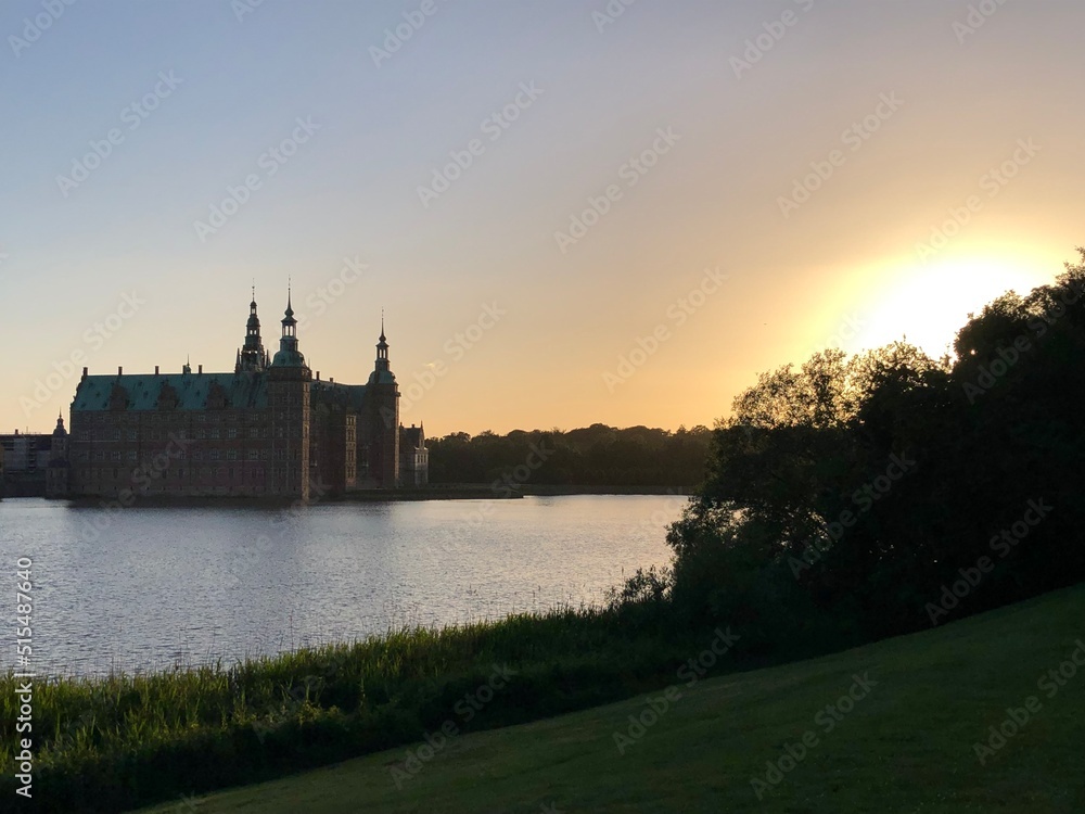 Fototapeta premium castle on the lake in the sunset