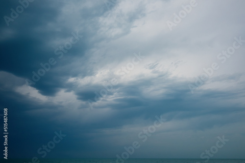 blue sea and cloudy sky on summer day.