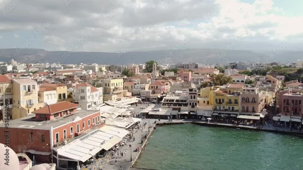 Old Venetian Port of Chania against beautiful cityscape, Crete, Greece. Scenic aerial Old Venetian Port of Chania against beautiful cityscape, Crete, Greece. Scenic aerial