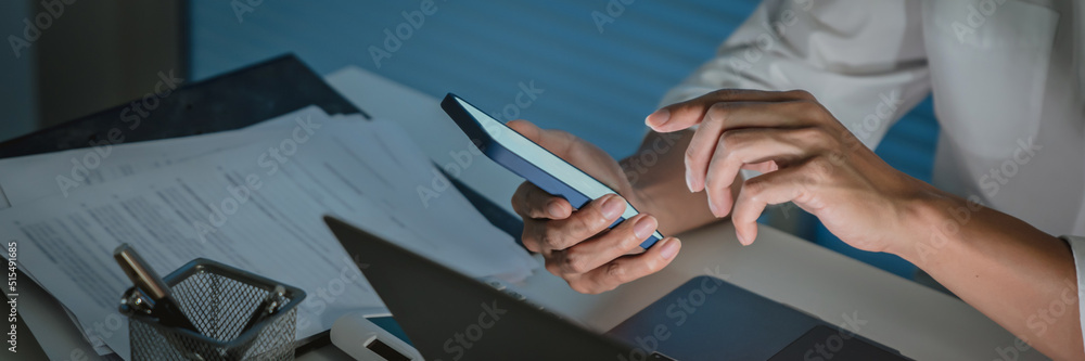 Close up male hands pointing on mobile phone in workplace.