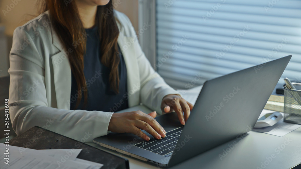Asian female accountant working with tax financial statement at home.. Asian female accountant working with tax financial statement at home..