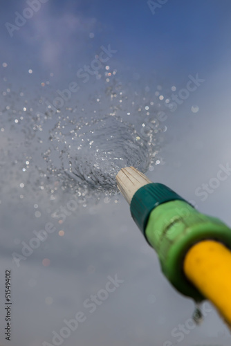 jet of water from a watering hose