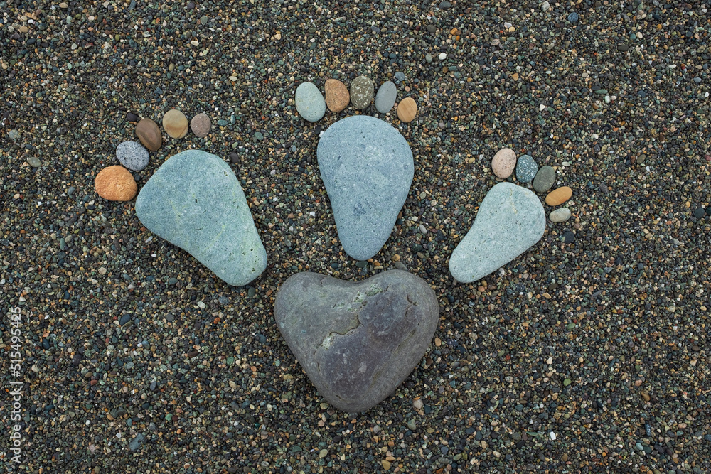 Happy feet. Stone arranged like a footprint on the beach Happy feet. Stone arranged like a footprint on the beach