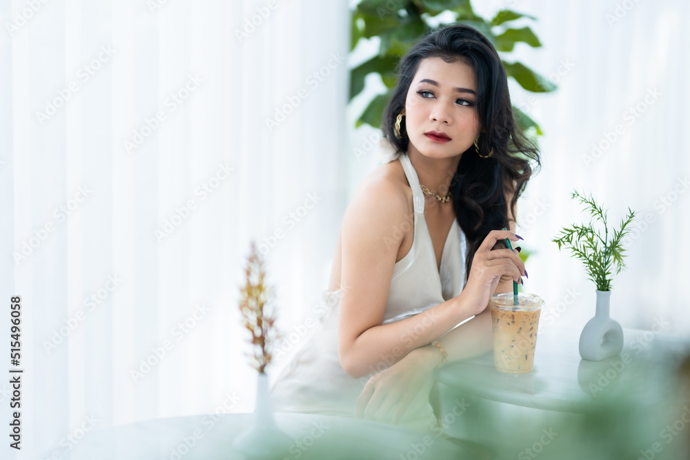 Portrait beautiful asian freelance Success people business woman fashion model in summer white sleeveless dress and coffee in cup in coffee shop. Portrait beautiful asian freelance Success people business woman fashion model in summer white sleeveless dress and coffee in cup in coffee shop.