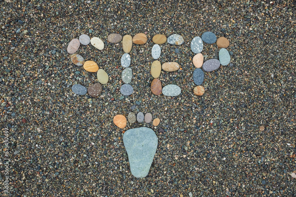 Stone arranged like a footprint on the beach Stone arranged like a footprint on the beach