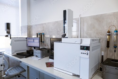 The gas chromatograph system with head space sampler. The system provides reliable capabilities for small or medium labs. Laboratory equipment for product quality control at the food production plant. photo