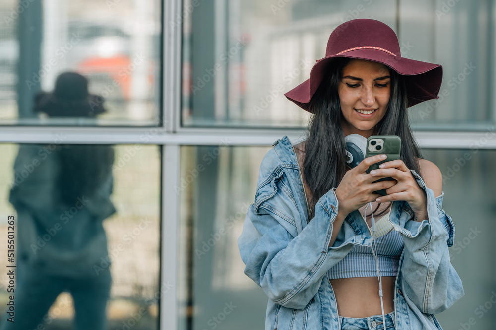 urban trendy hipster girl with mobile phone