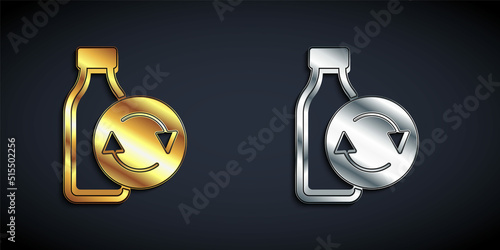 Gold and silver Recycling plastic bottle icon isolated on black background. Long shadow style. Vector