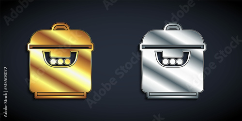 Gold and silver Slow cooker icon isolated on black background. Electric pan. Long shadow style. Vector