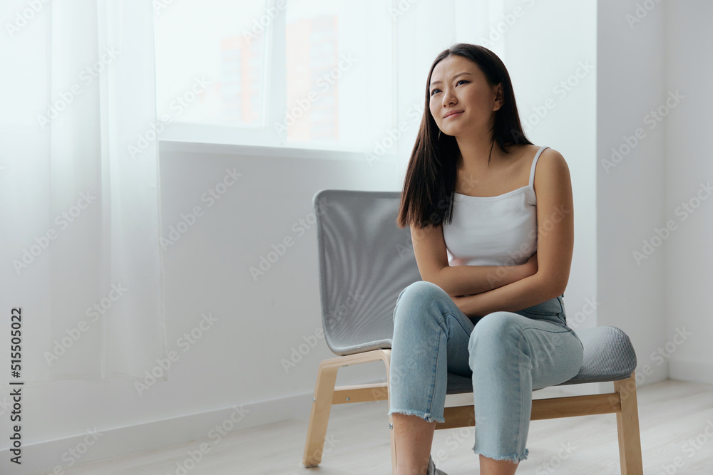 Pregnancy lost. Abortion high. Tormented suffering tanned beautiful young Asian woman hold hands on stomach at home interior living room. Injuries Poor health Illness concept. Cool offer Banner Pregnancy lost. Abortion high. Tormented suffering tanned beautiful young Asian woman hold hands on stomach at home interior living room. Injuries Poor health Illness concept. Cool offer Banner