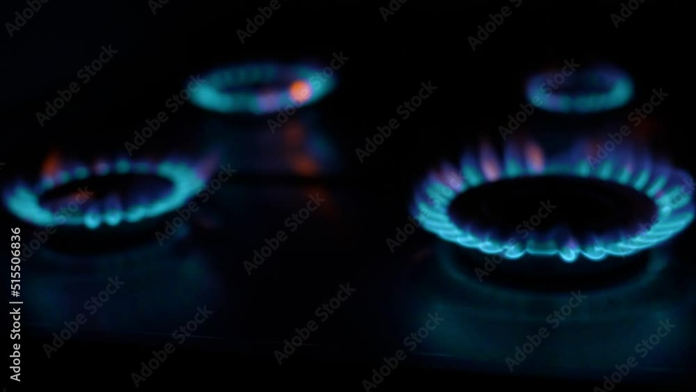 Gas cooker with burning flames of blue propane gas. Gas cooker with burning flames of blue propane gas.