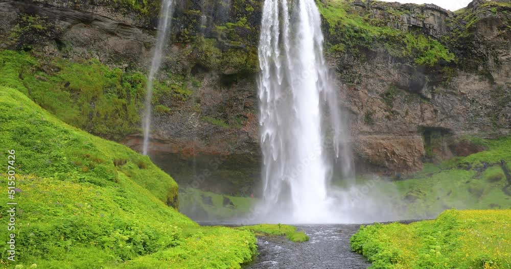 Waterfall backflow (reverse) concept - Amazing Seljalandsfoss waterfall in Iceland Waterfall backflow (reverse) concept - Amazing Seljalandsfoss waterfall in Iceland