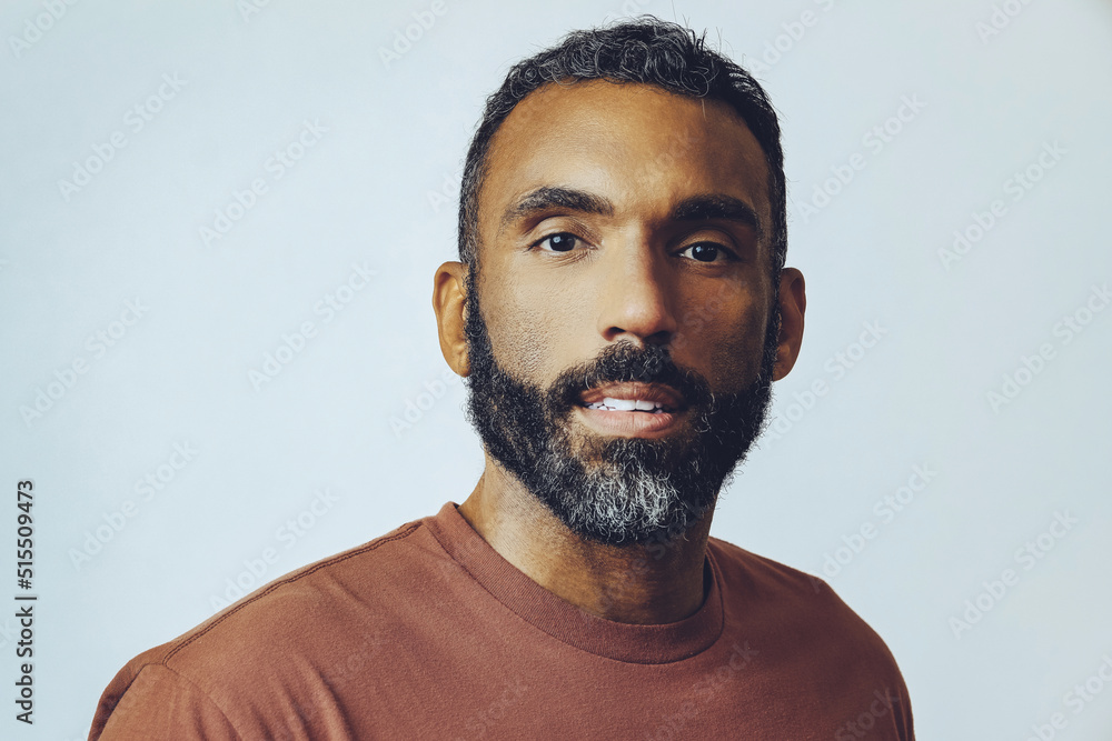 close up of mid adult man with beard indoors studio close up of mid adult man with beard indoors studio