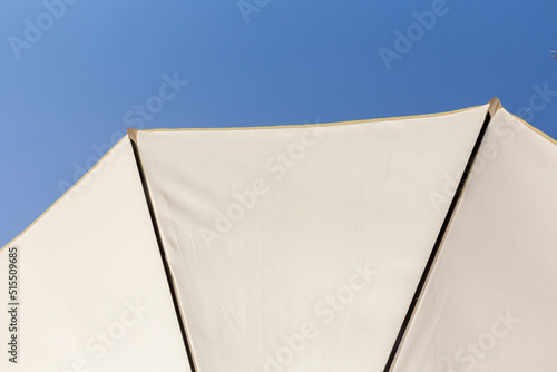  parasol under clear blue sky