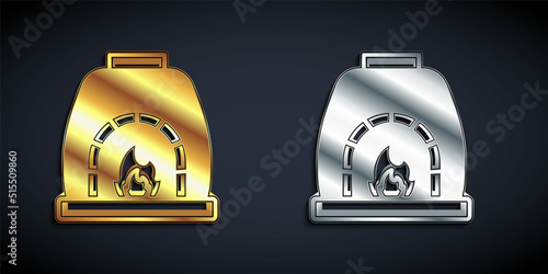 Gold and silver Blacksmith oven icon isolated on black background. Long shadow style. Vector