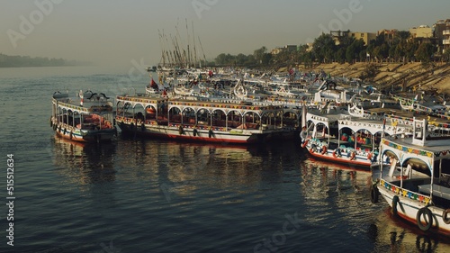 Boats for transporting tourists moored on the bank of the Nile