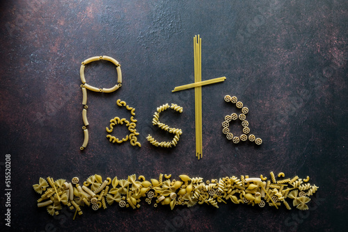 The word Pasta made from pasta noodles, against a dark background.