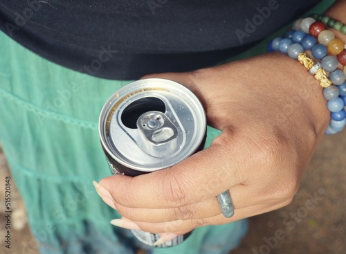 Selfie of cola can drink on hand