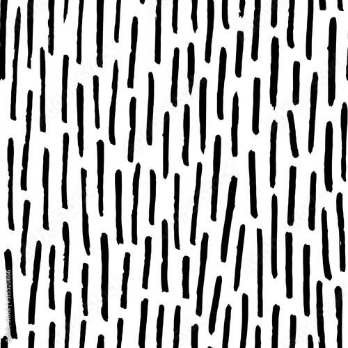 Thin vertical dashes vector seamless pattern. Black linear ornament. Memphis style background with small pen stripes. Retro black and white texture. Hand drawn regular doodle simple lines. 