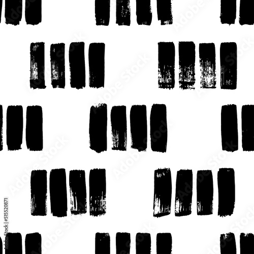 Short hand drawn strokes vector seamless pattern. Vertical black brush strokes in a row. Monochrome grunge texture in hipster style. Black paint dry brushstrokes. Short vertical lines or dashes