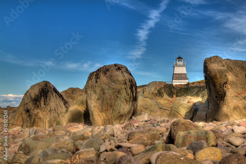 black and white lighthouse with rocks
