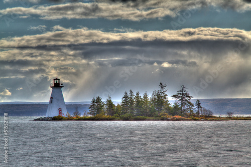 island lighthouse with sun shafts