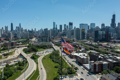 Aerial, drone shot of a Pride Flag over the Chicago Skyline during a Pride Month