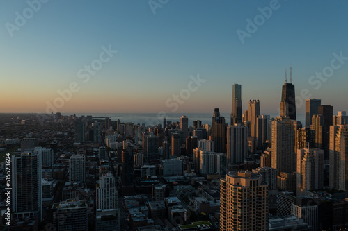 Aerial  drone view of Chicago downtown skyline and Lake Michigan during sunset 