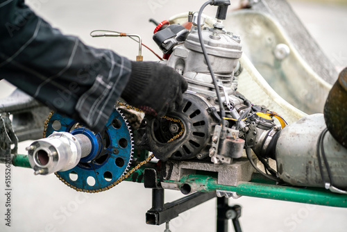 mechanic repair the karting engine in workshop