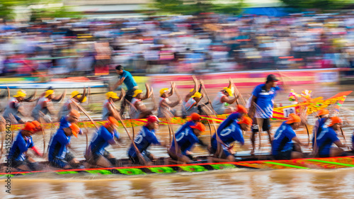 Blurry motion of boat racing in the traditional Ngo boat racing festival of Khmer people in Soc Trang, Vietnam.  photo