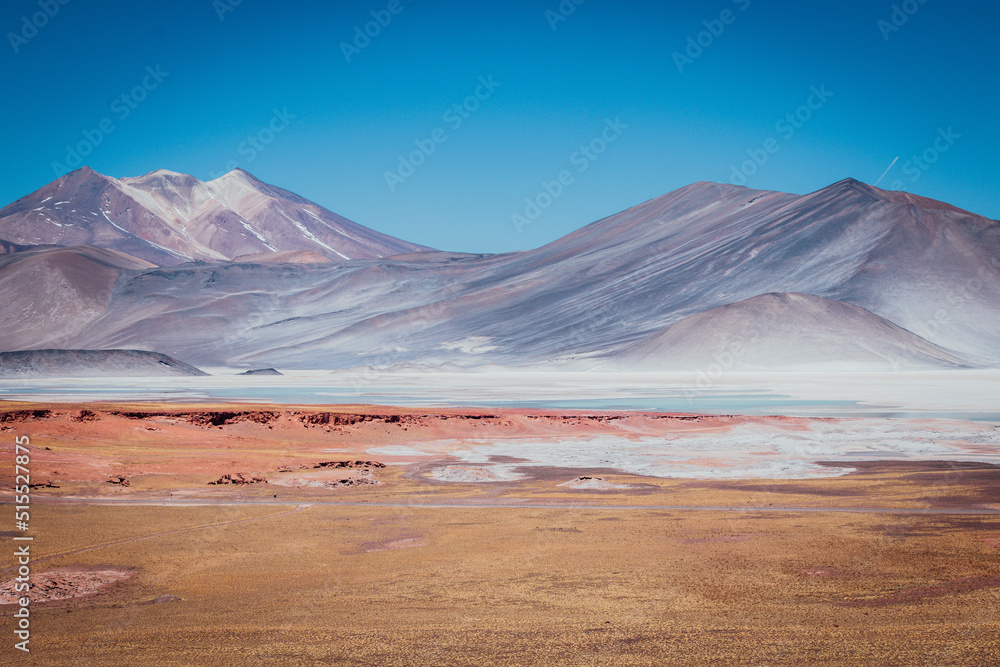 crater lake in atacama desert with colorful mountain range crater lake in atacama desert with colorful mountain range