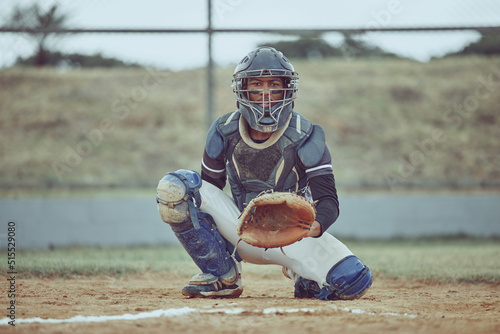 Photography Portrait african american pitcher ready to make a catch with a mitt on a baseball field