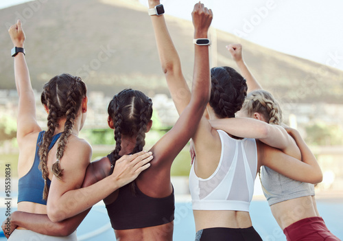 Φωτογραφία Rear view of proud excited Olympic champions hugging and cheering together in unity