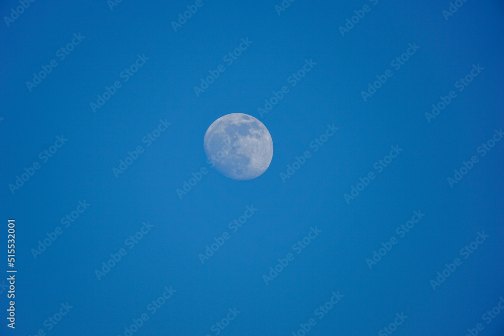 Moon against the dark blue sky