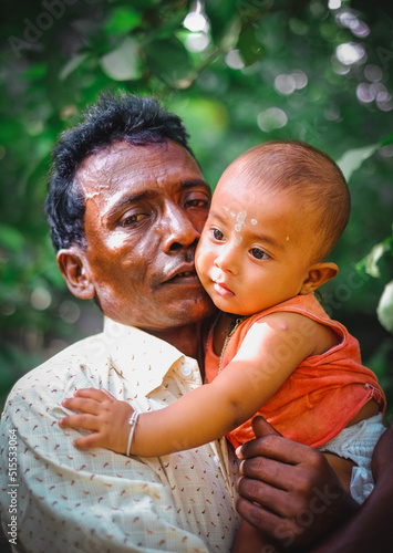 Family portrait of south asian cute charming baby boy with his grandfather 