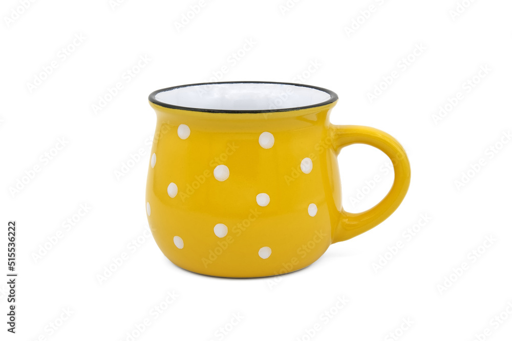 Yellow with white dots cup isolated on a white Yellow with white dots cup isolated on a white