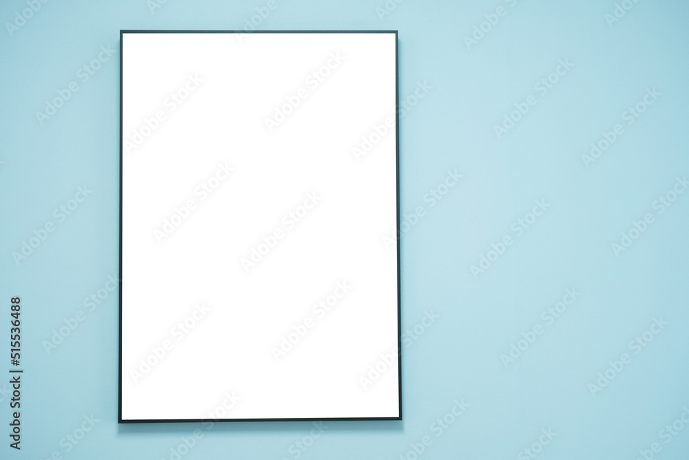 Empty portrait frame on blue wall close-up. Empty portrait frame on blue wall close-up.