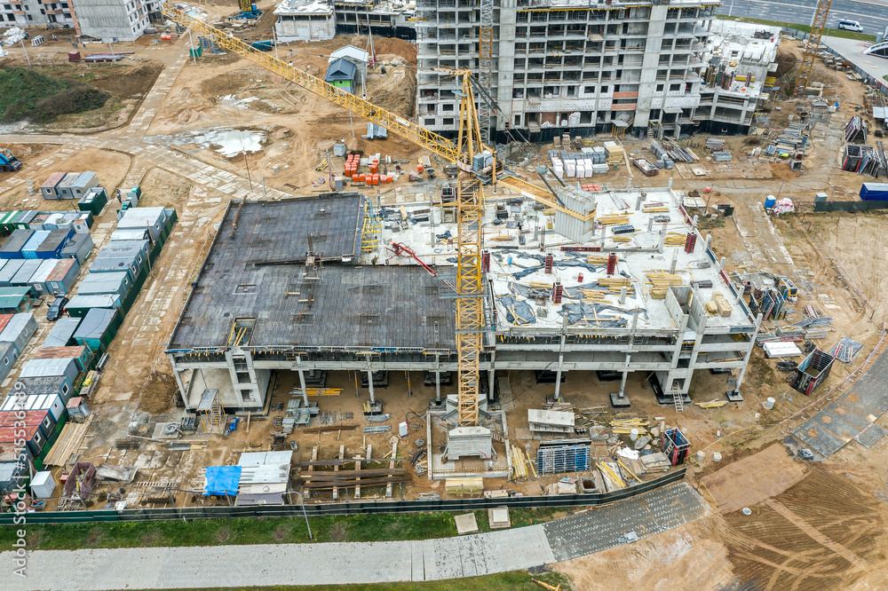 Fototapeta premium new multilevel carpark under construction. development of new residential area. drone photo.