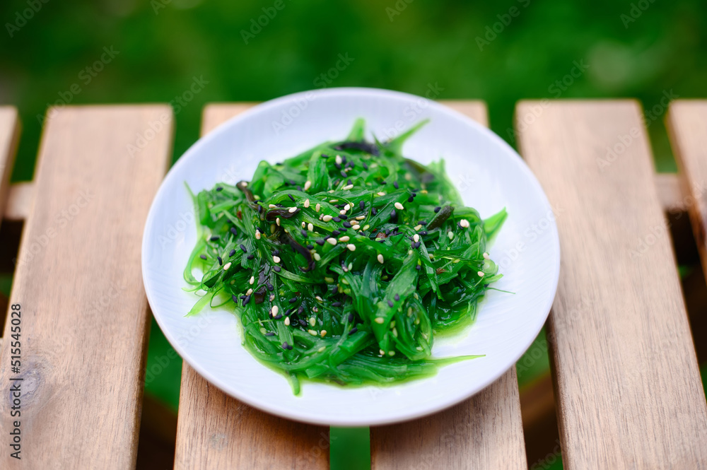 Seaweed japanese chuka salad garnished with sesame seeds Seaweed japanese chuka salad garnished with sesame seeds