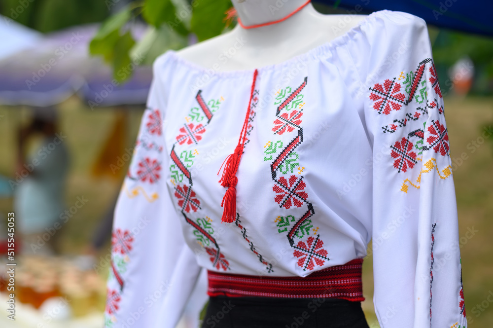 Traditional female Moldavian costume on mannequin, outdoor festival