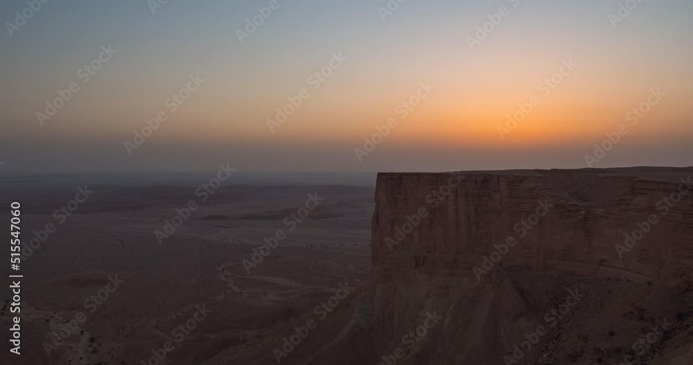 Timelapse of the sun setting at Edge of the World escarpment tourist area near Riyadh, Saudi Arabia Timelapse of the sun setting at Edge of the World escarpment tourist area near Riyadh, Saudi Arabia