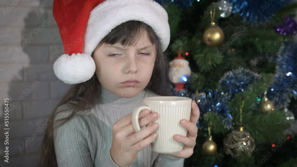 Sad childhood at alone Christmas eve. A sad little girl celebrate the festive day of Christmas in loneliness by the fir-tree. Sad childhood at alone Christmas eve. A sad little girl celebrate the festive day of Christmas in loneliness by the fir-tree.