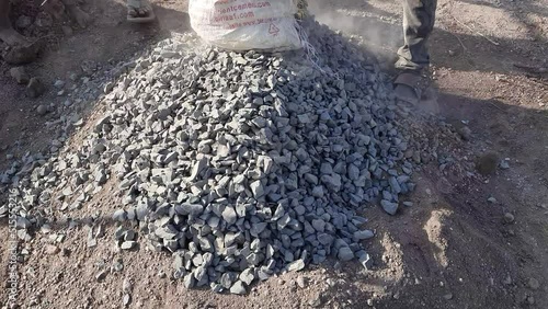 Construction Workers Mixing Cement concrete. Hand Mixing of Concrete And Procedure - Civil work photo