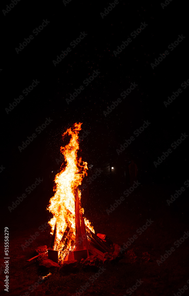 Warm camp fire and sparks during a party in the night Warm camp fire and sparks during a party in the night